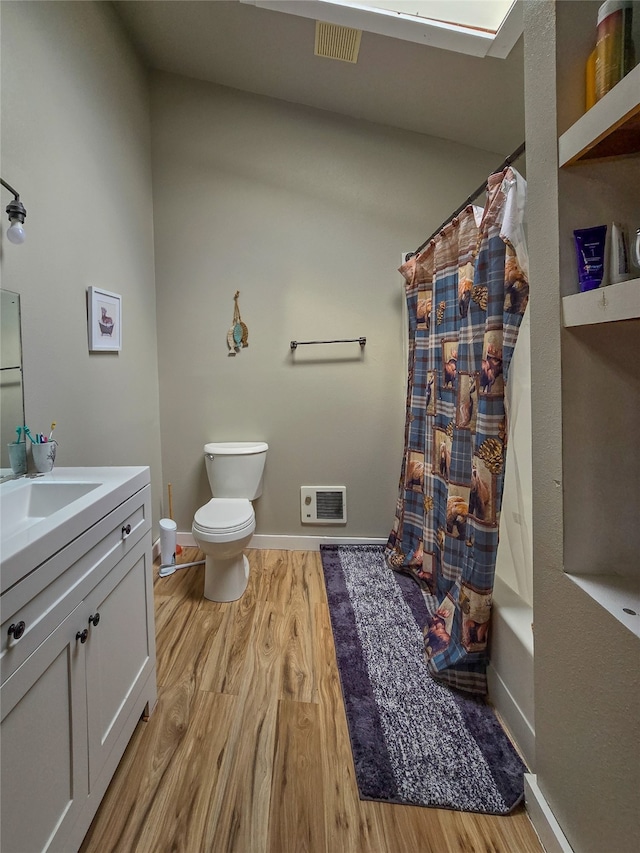 full bathroom featuring shower / tub combo, vanity, toilet, and hardwood / wood-style flooring