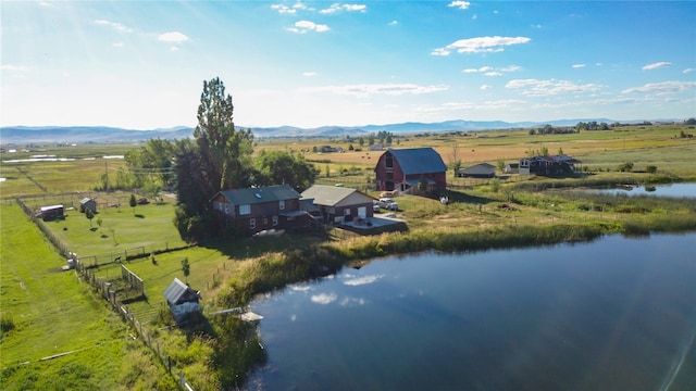 aerial view with a rural view and a water and mountain view