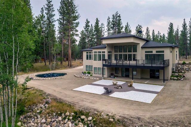 back of property featuring a patio area