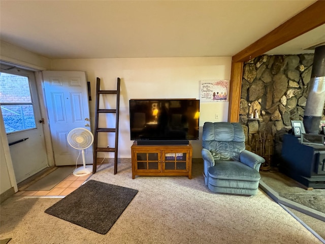 tiled living room with a wood stove