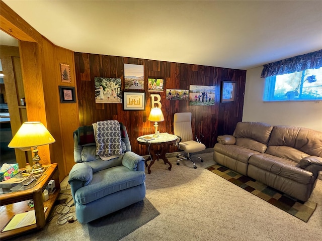 carpeted living room featuring wood walls