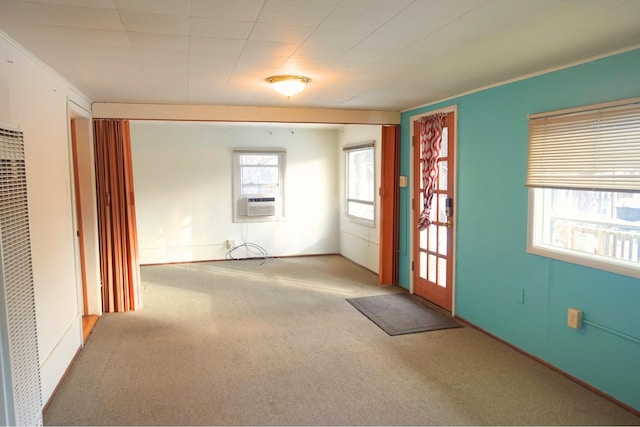 entrance foyer featuring cooling unit and light colored carpet