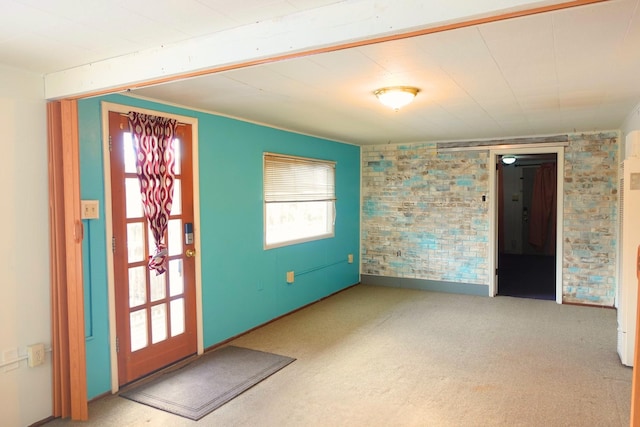 view of carpeted foyer