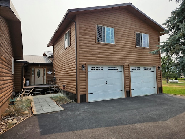 view of property exterior with a garage