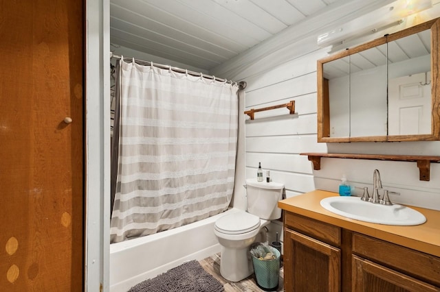 full bath with toilet, shower / bath combo with shower curtain, and vanity