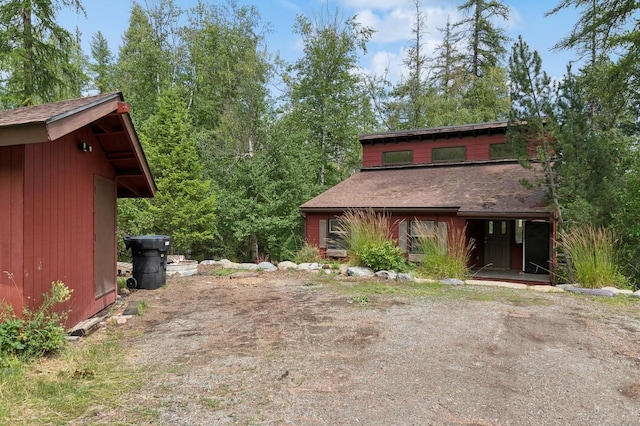 view of front of home featuring a shingled roof