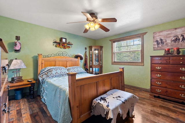 635 Lore Lake Rd, Kalispell, MT 59901 - bedroom with dark wood-style flooring and ceiling fan