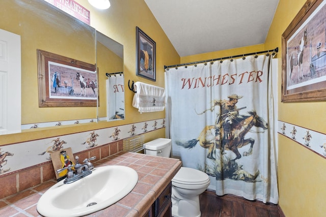 635 Lore Lake Rd, Kalispell, MT 59901 - bathroom featuring wood finished floors, a shower with shower curtain, vanity, and toilet