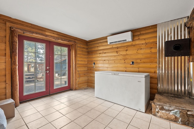 635 Lore Lake Rd, Kalispell, MT 59901 - interior space featuring light tile patterned floors, an AC wall unit, french doors, fridge, and rustic walls