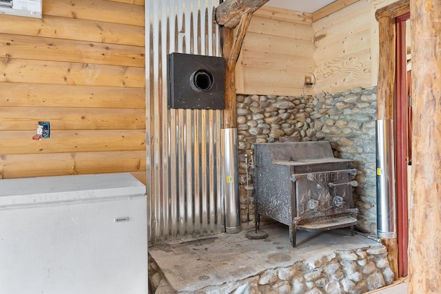 635 Lore Lake Rd, Kalispell, MT 59901 - interior space with fridge and a wood stove