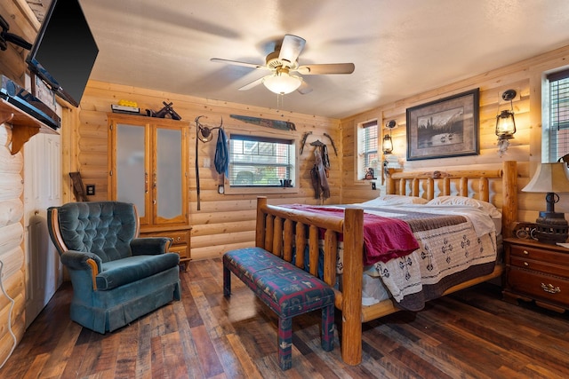 635 Lore Lake Rd, Kalispell, MT 59901 - bedroom featuring rustic walls, ceiling fan, and hardwood / wood-style floors