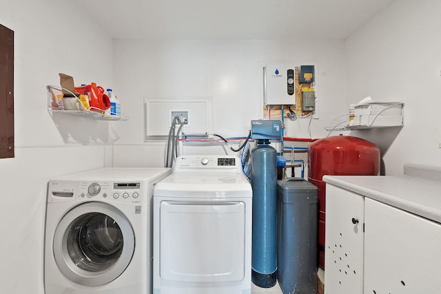 635 Lore Lake Rd, Kalispell, MT 59901 - laundry area with washer and dryer, electric panel, and cabinet space