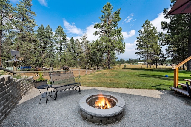 635 Lore Lake Rd, Kalispell, MT 59901 - view of patio / terrace with a fire pit