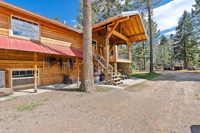 635 Lore Lake Rd, Kalispell, MT 59901 - exterior space with metal roof and stairway