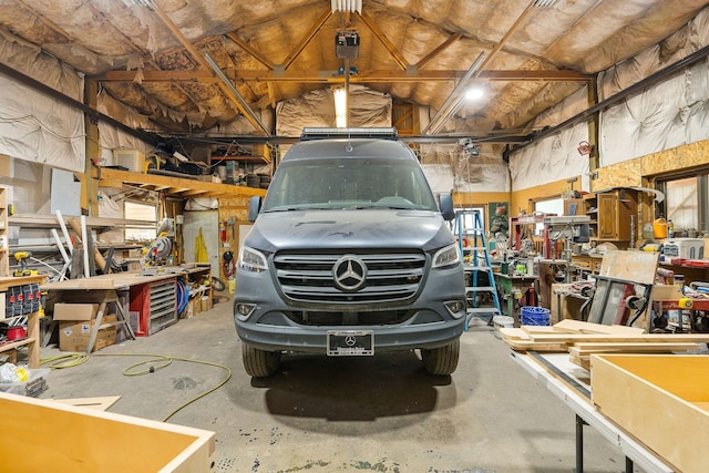 635 Lore Lake Rd, Kalispell, MT 59901 - garage with a workshop area and a garage door opener