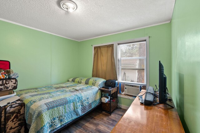 635 Lore Lake Rd, Kalispell, MT 59901 - bedroom featuring a textured ceiling, ornamental molding, cooling unit, and wood finished floors