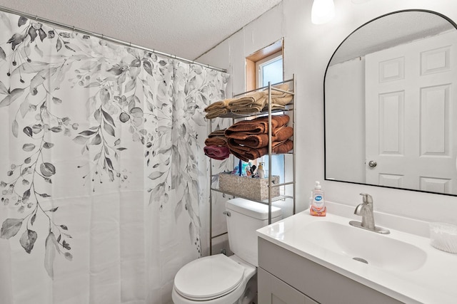 635 Lore Lake Rd, Kalispell, MT 59901 - bathroom with toilet, curtained shower, a textured ceiling, and vanity