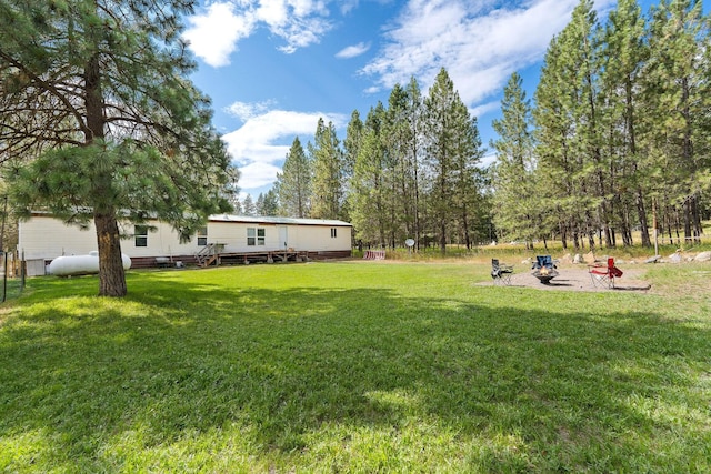 635 Lore Lake Rd, Kalispell, MT 59901 - view of yard with a fire pit