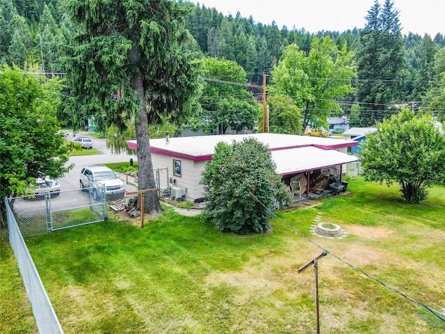 822 W Balsam St, Libby, MT 59923 - back of property featuring a gate and a forest view