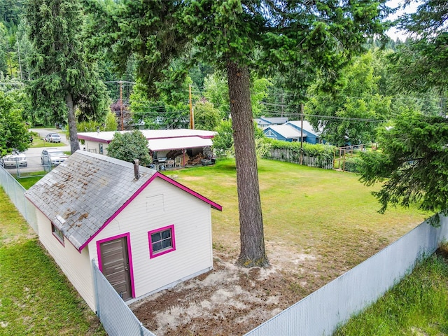 view of yard with a garage and an outdoor structure