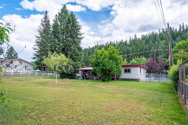 822 W Balsam St, Libby, MT 59923 - fenced backyard featuring a forest view