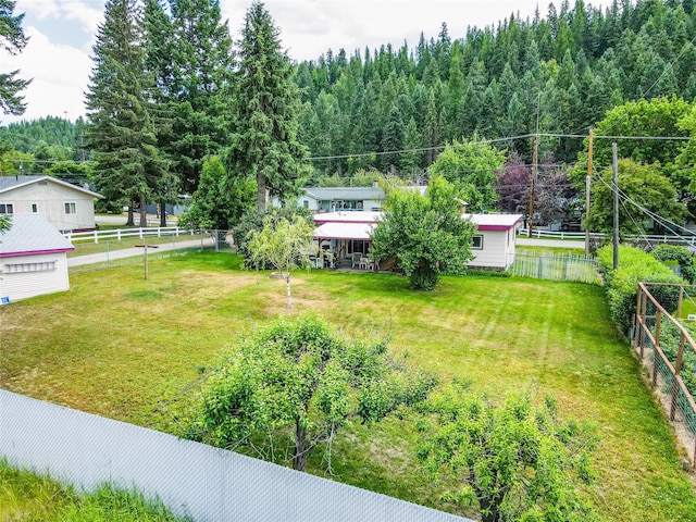 822 W Balsam St, Libby, MT 59923 - fenced backyard with a view of trees