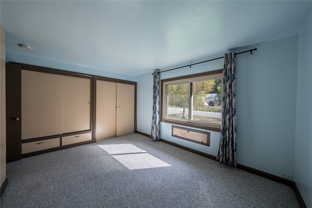 unfurnished bedroom with carpet flooring