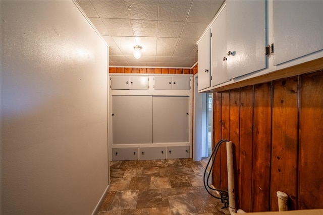 mudroom featuring stone finish floor
