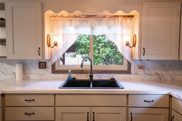 kitchen featuring a sink and backsplash