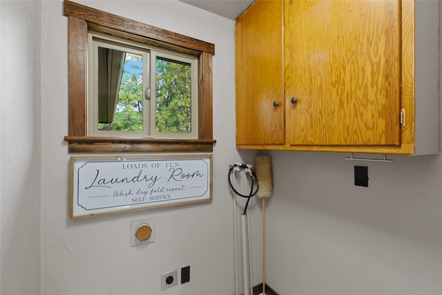 908 10th St, Whitefish, MT 59937 - laundry room with electric dryer hookup and cabinet space