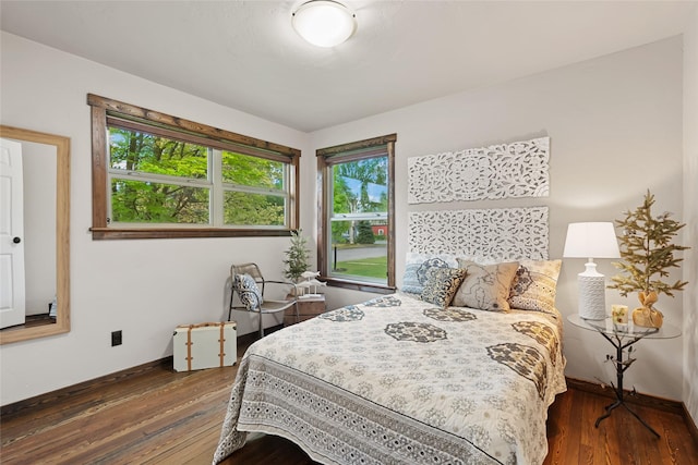 908 10th St, Whitefish, MT 59937 - bedroom featuring wood-type flooring and multiple windows