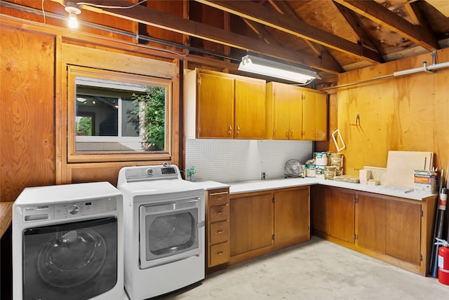 908 10th St, Whitefish, MT 59937 - laundry room featuring cabinet space, washer and clothes dryer, and wooden walls