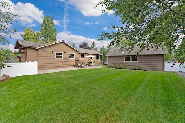 908 10th St, Whitefish, MT 59937 - rear view of property featuring a patio area and roof with shingles