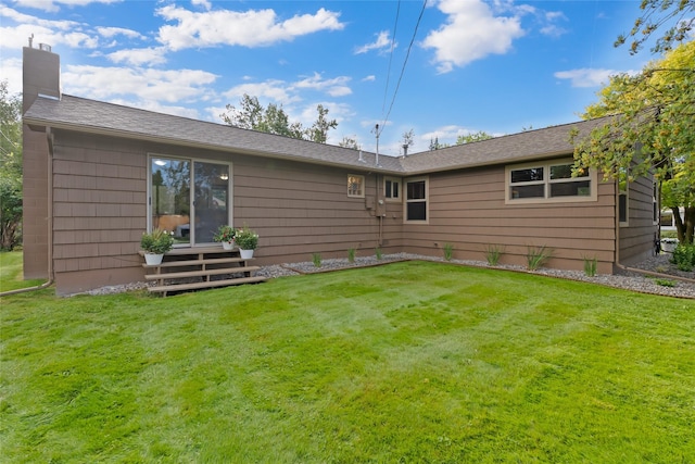908 10th St, Whitefish, MT 59937 - back of house featuring a chimney and a lawn