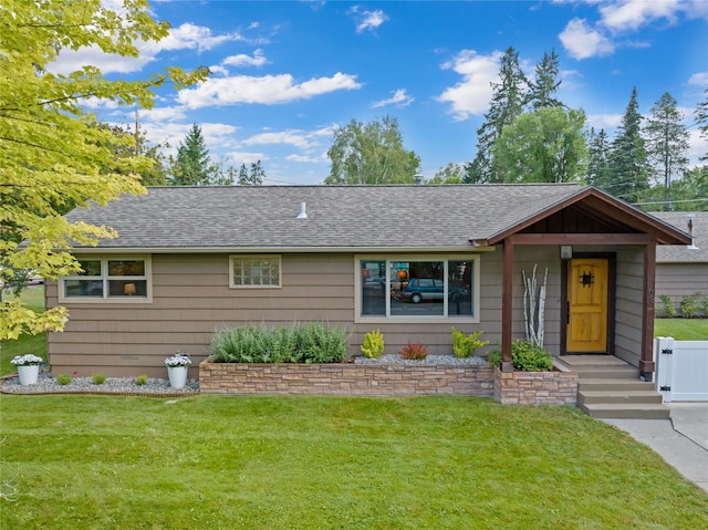 908 10th St, Whitefish, MT 59937 - single story home with a shingled roof and a front lawn