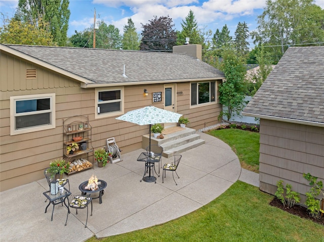 908 10th St, Whitefish, MT 59937 - view of patio featuring an outdoor fire pit