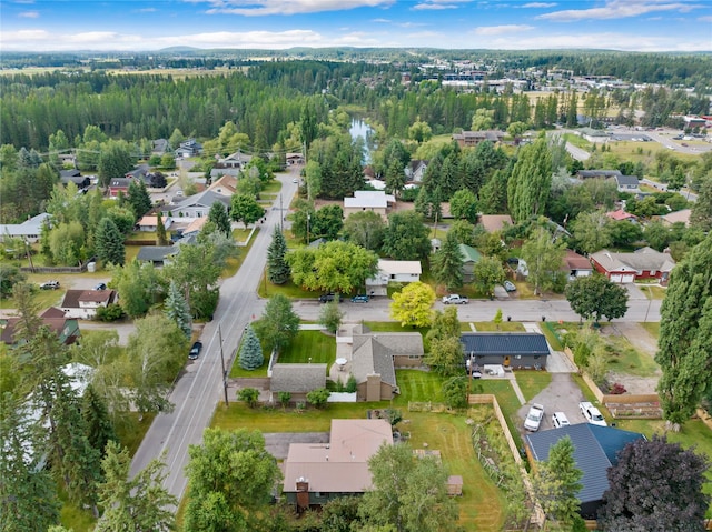 908 10th St, Whitefish, MT 59937 - view of property location featuring nearby suburban area and a heavily wooded area