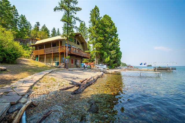 back of house with a water view