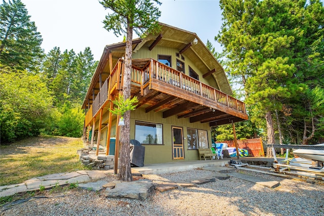 rear view of property featuring a patio area