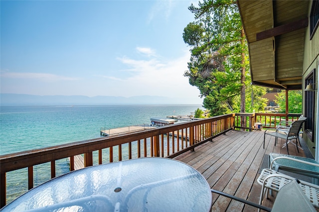 wooden terrace with a water view