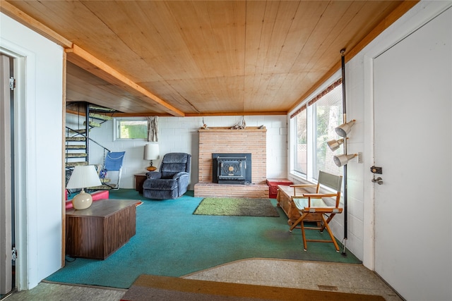 living room with carpet floors, a fireplace, and wooden ceiling