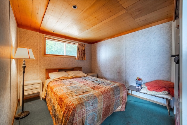 carpeted bedroom with wood ceiling