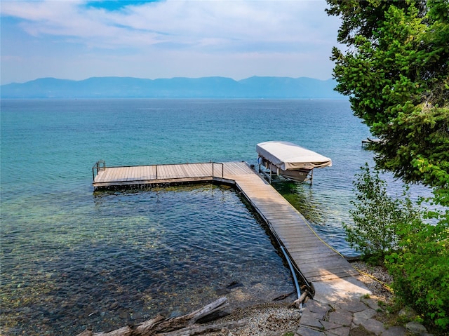 dock area featuring a water and mountain view