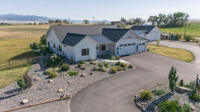 birds eye view of property with a mountain view and a rural view