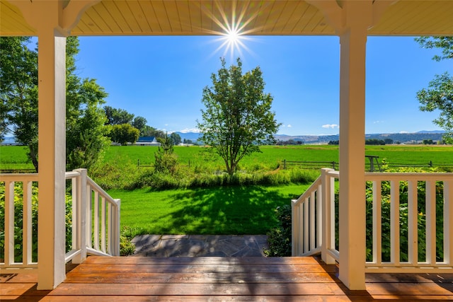 wooden terrace with a mountain view and a rural view