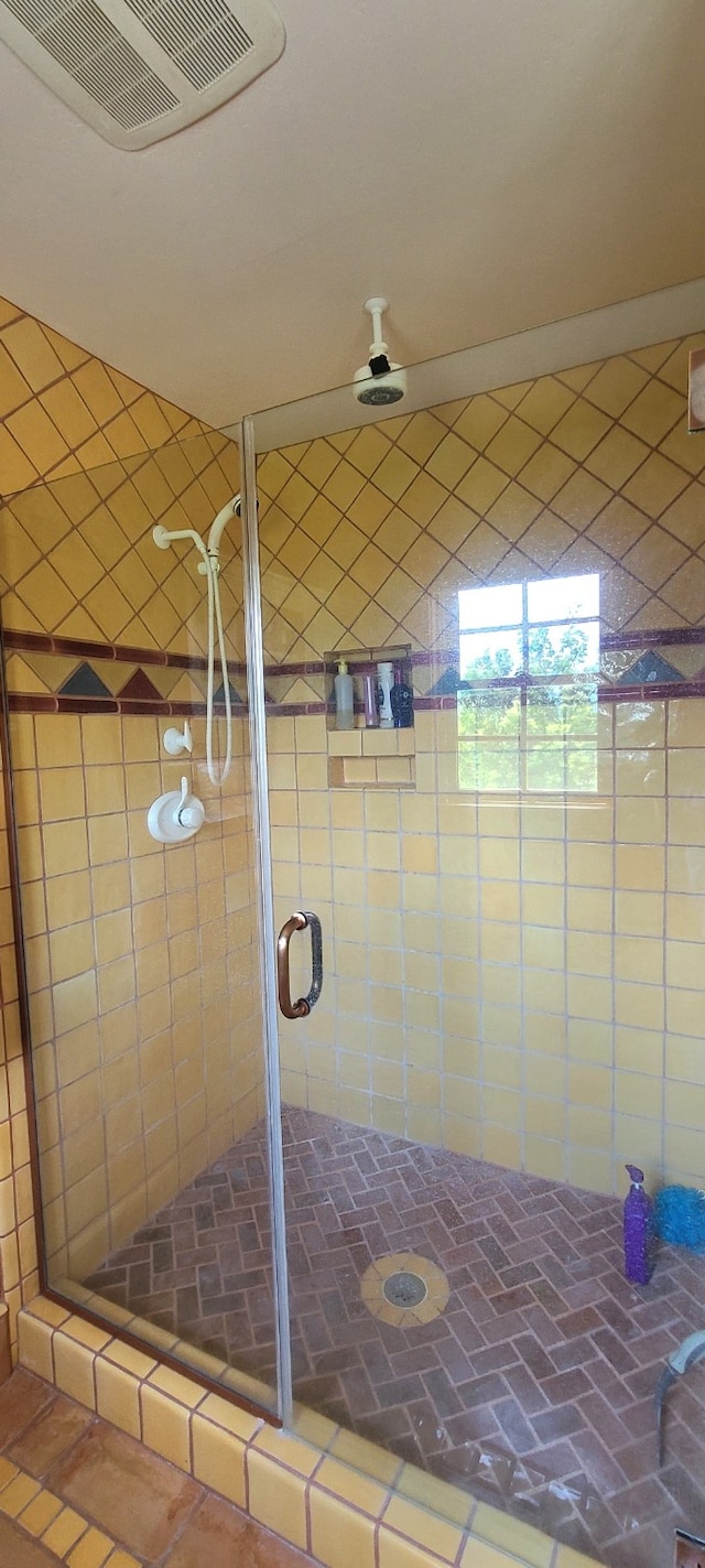 bathroom featuring an enclosed shower