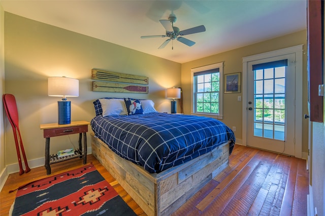 bedroom with ceiling fan, hardwood / wood-style flooring, and access to outside