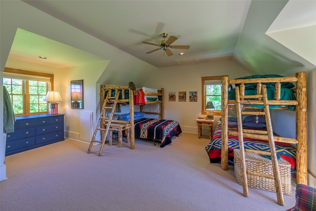 bedroom featuring lofted ceiling, ceiling fan, and carpet