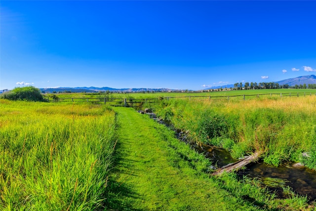 view of local wilderness with a mountain view and a rural view