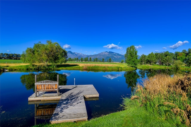 dock area featuring a water and mountain view